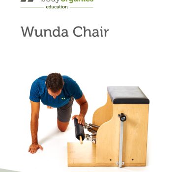 Wunda Chair with man doing side plank